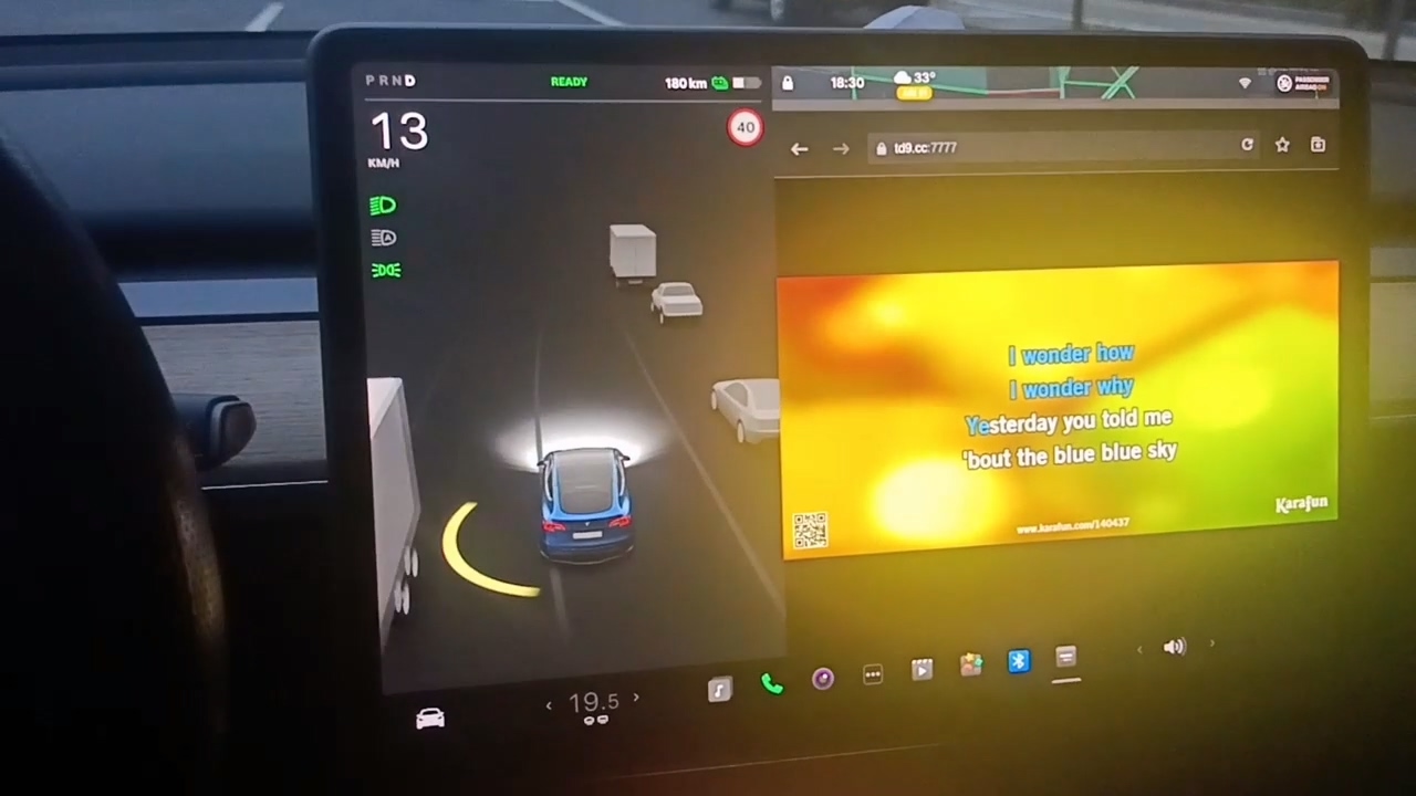 The screenshot of playing karaoke songs on Tesla's screen